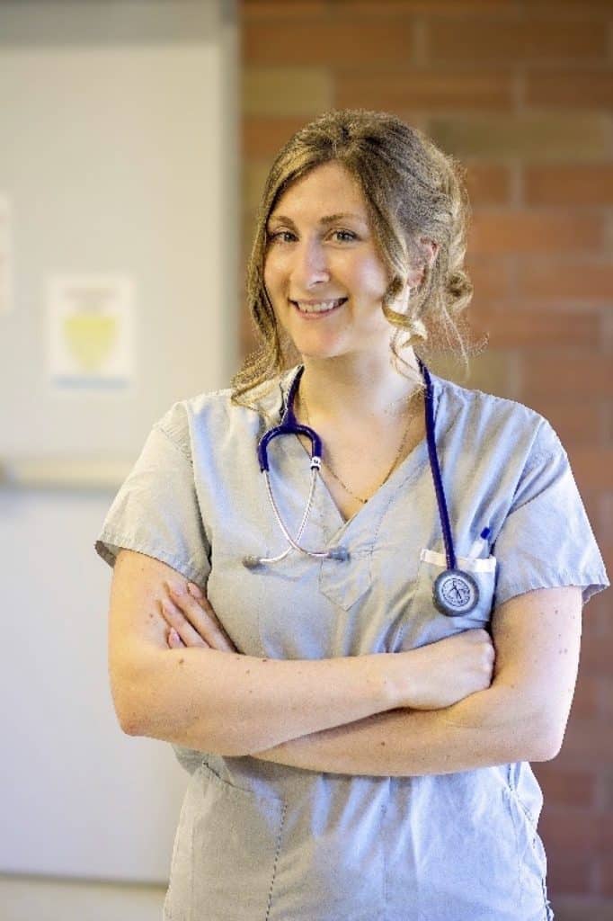 Three images of staff of the Saanich Peninsula Hospital. The first is a woman with a stethoscope around her neck, the second is a man sitting in a hair in a clinical setting, and the third is a group of 15 clinical staff together in the hospital hallway. 